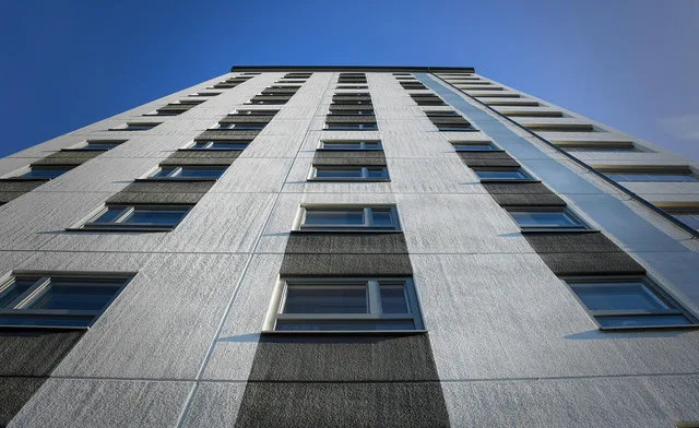 building, high-rise building, architecture, facade, residential building, apartment building. Apartment EV charger access referral: who owns the next question