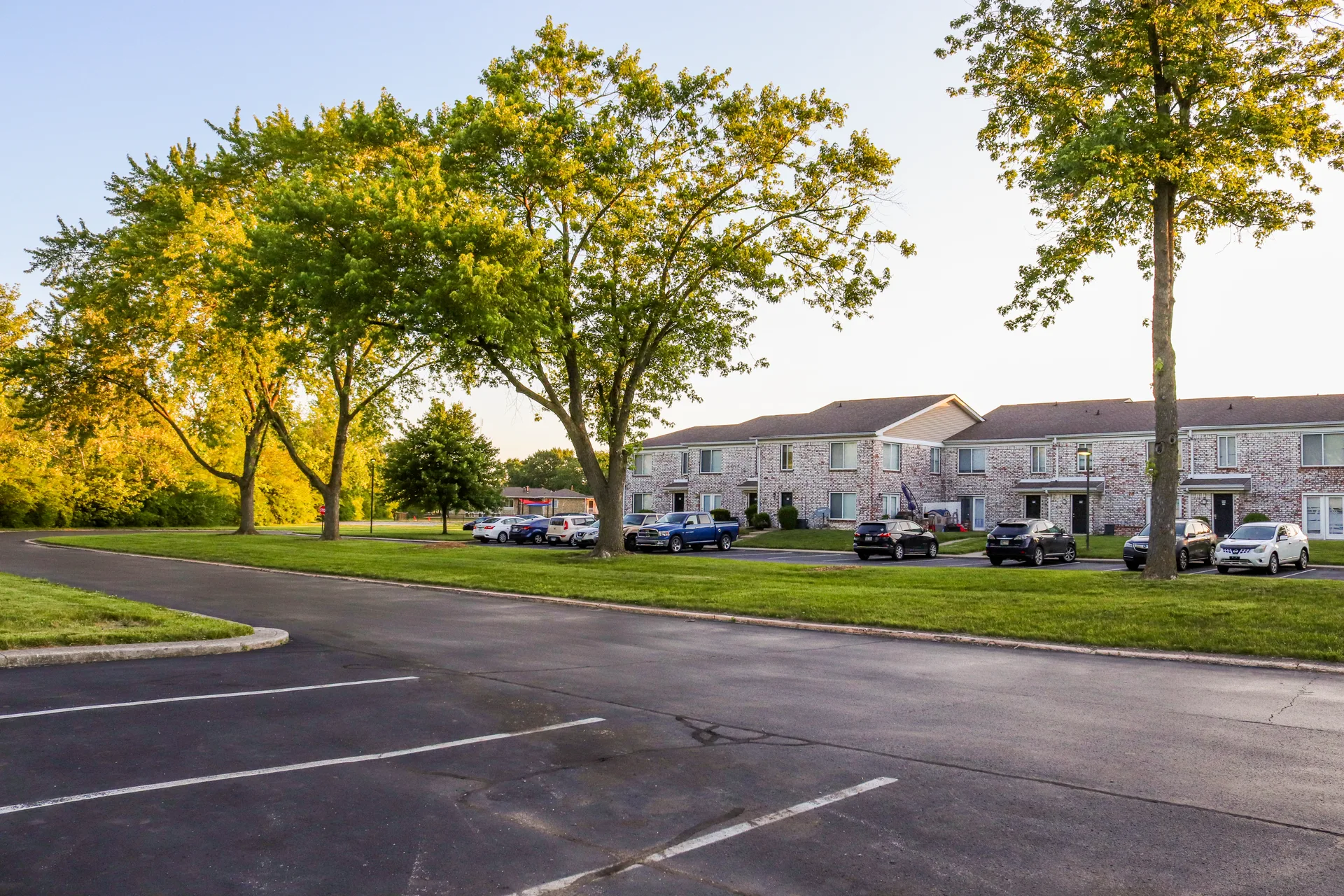 Empty parking lot at apartment complex. Apartment EV charger authorization gaps: build a gap log