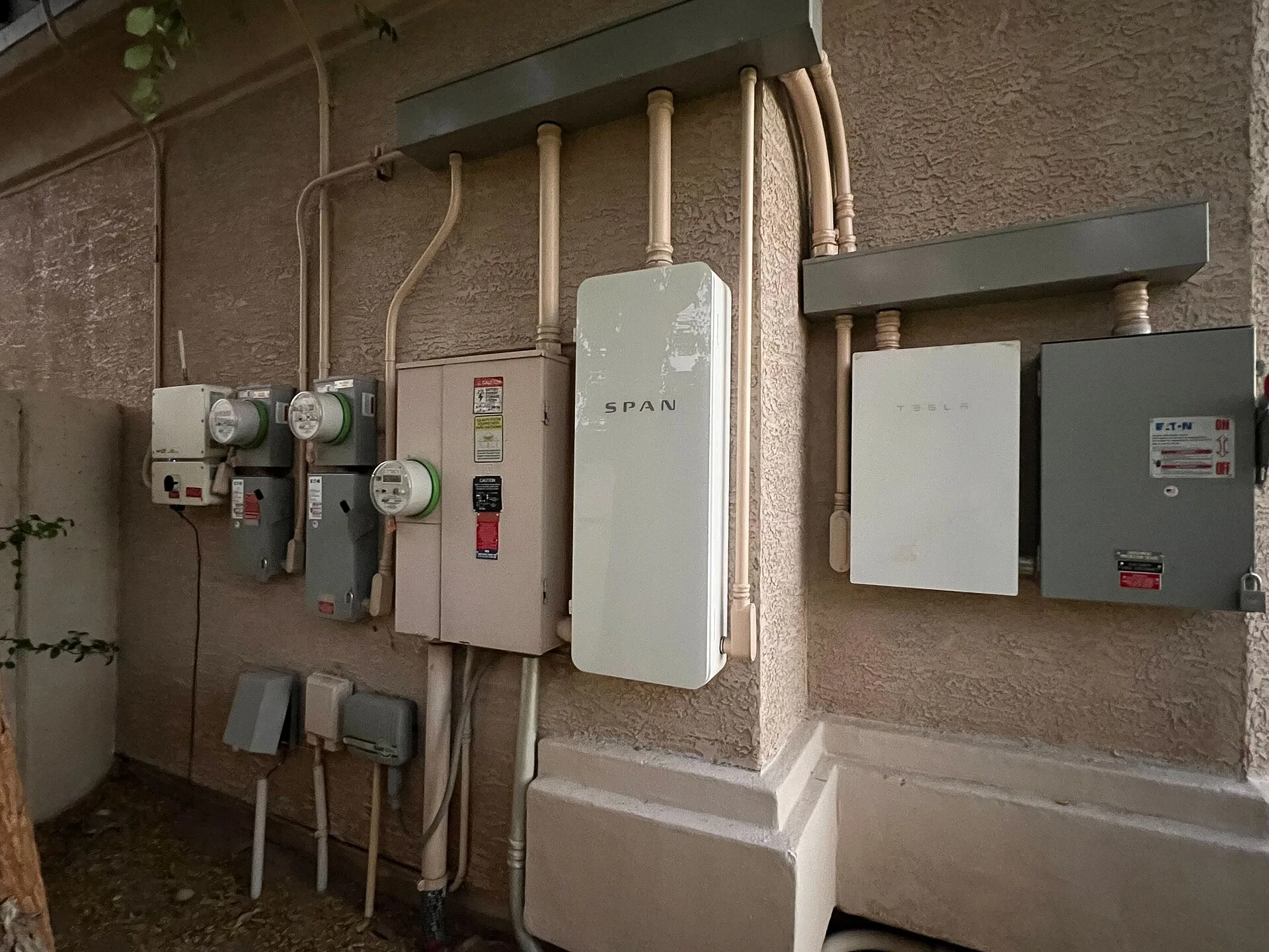 A smart panel (SPAN panel) and multiple meters installed on an electrical service entrance in Phoenix, AZ. Apartment EV charger baseline scenario: a record guide