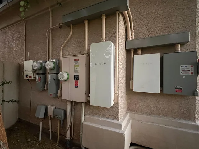A smart panel (SPAN panel) and multiple meters installed on an electrical service entrance in Phoenix, AZ. Apartment EV charger baseline scenario: a record guide