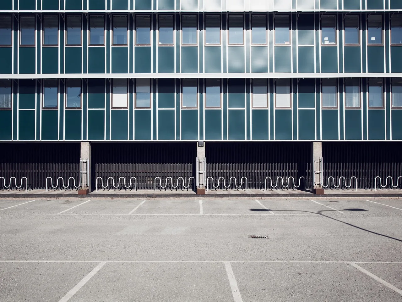 architecture, building, glass, parking lot, windows, parking lot, parking lot, parking lot, parking lot, parking lot. How to document apartment EV charger planning inputs for 2027 scenarios
