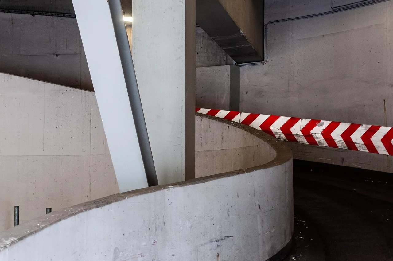 multi storey, car park, driveway, garage, building, urban, parking lot, parking. Apartment EV charger commissioning records: what to keep and for how long