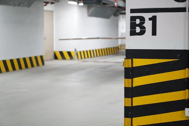 parking lot, underground, garage, car lot, parking lot, parking lot, parking lot, parking lot, parking lot, garage, garage. Apartment EV charger safety reporting: where defects go