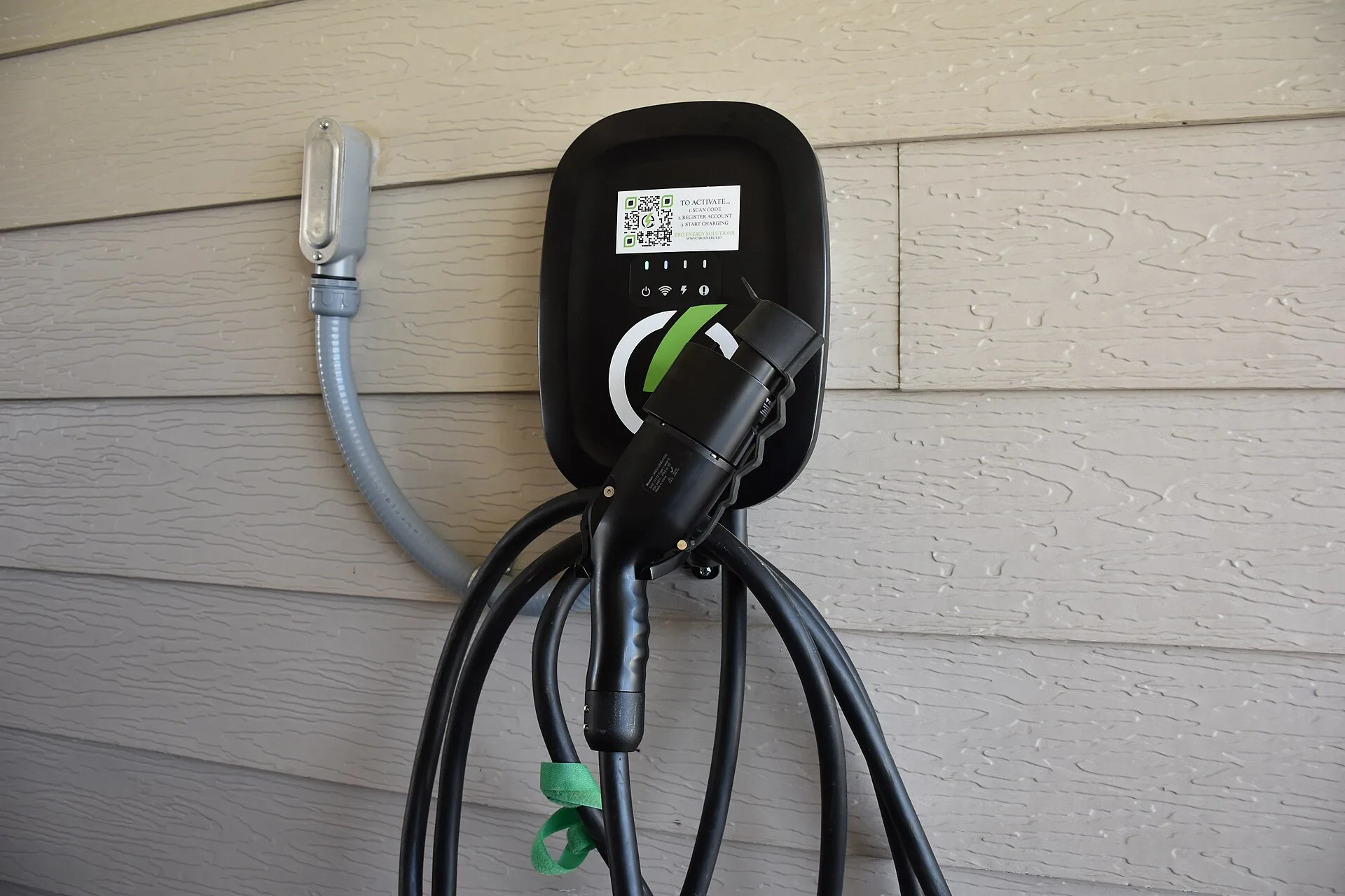 A Level 2 EV charger is seen mounted on the side of a Cavalry Family Housing residence March 19, 2024. TRO Energy Solutions will install, test and maintain the charger for housing residents who sign up for the service. (U.S. Army photo by Janecze Wright, Fort Cavazos Public Affairs). Apartment EV charger signage observation: what to record