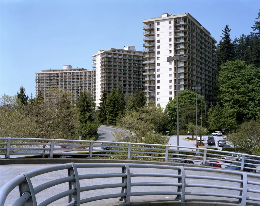 Three apartment buildings and a parking ramp in North Vancouver. Apartment EV charging eligibility worksheet: how to build one