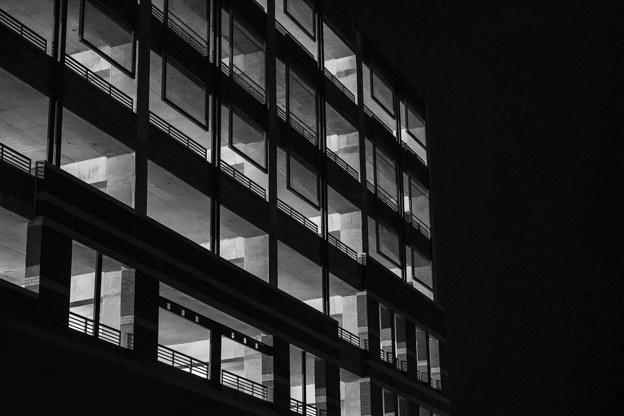 multi-storey car park, parking garage, parkade, building, car park, parking deck, night, concrete, structure, architecture, dark, black car, black building, gray night, black park, gray park, black garage, gray garage, parking garage, parking garage, parking garage, parking garage, parking garage. Apartment and condo EV charging roadmap: organizing the first 90 days