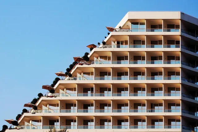 hotel, architecture, sea, nature, afternoon, sunlight, tran thang nhat, building, blue sky, holiday, apartment. Apartment EV charging subscription review: how to scope 2027 work